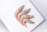 Four whole brown shrimp on top of plate thumbnail