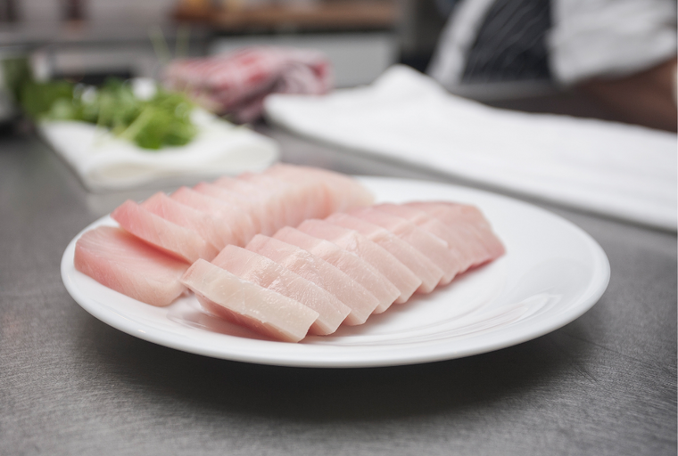 a plate with albacore tuna on a counter