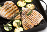 Cooked Swordfish steaks with grill marks with zucchini and rosemary thumbnail